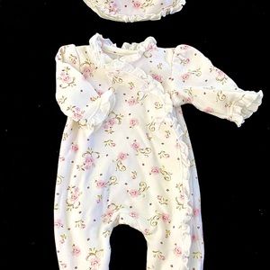 Brand-new newborn baby girl’s outfit w/snap closures, matching cap & headband.